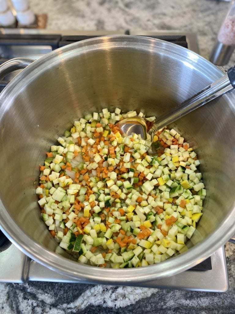 Vegan chili ingredients in a pot on the stove. 