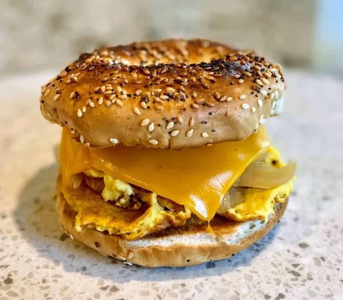 Just Egg Breakfast sandwich on an Everything bagel with vegan cheese. 