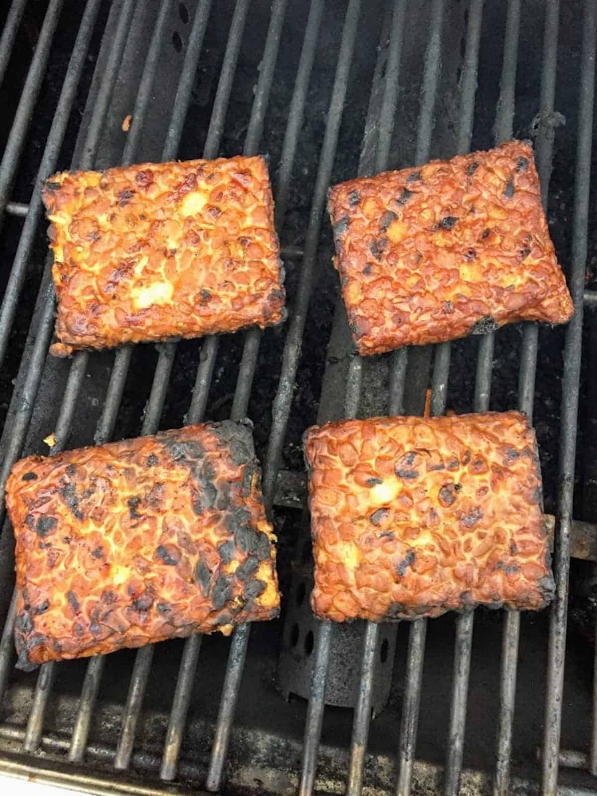 Marinated tempeh on the grill cooking