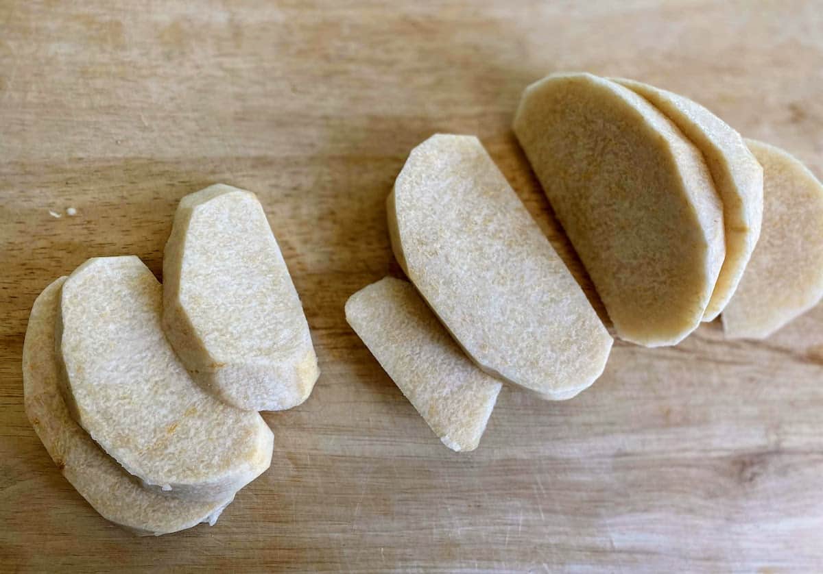 Sliced jicama on a cutting board