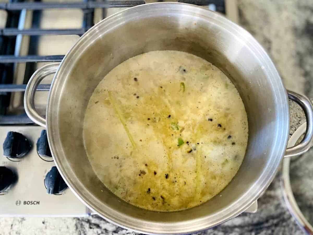 cooking the vegan corn chowder on the stove