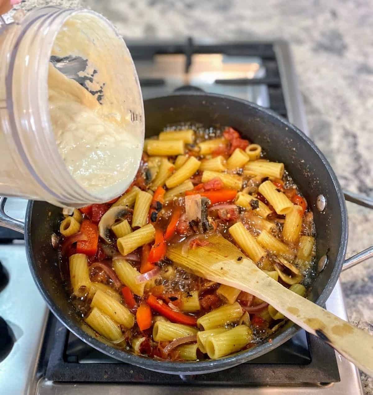 Add the creamy ingredients blended together in the blender to the cooked ingredients and stir to combine.