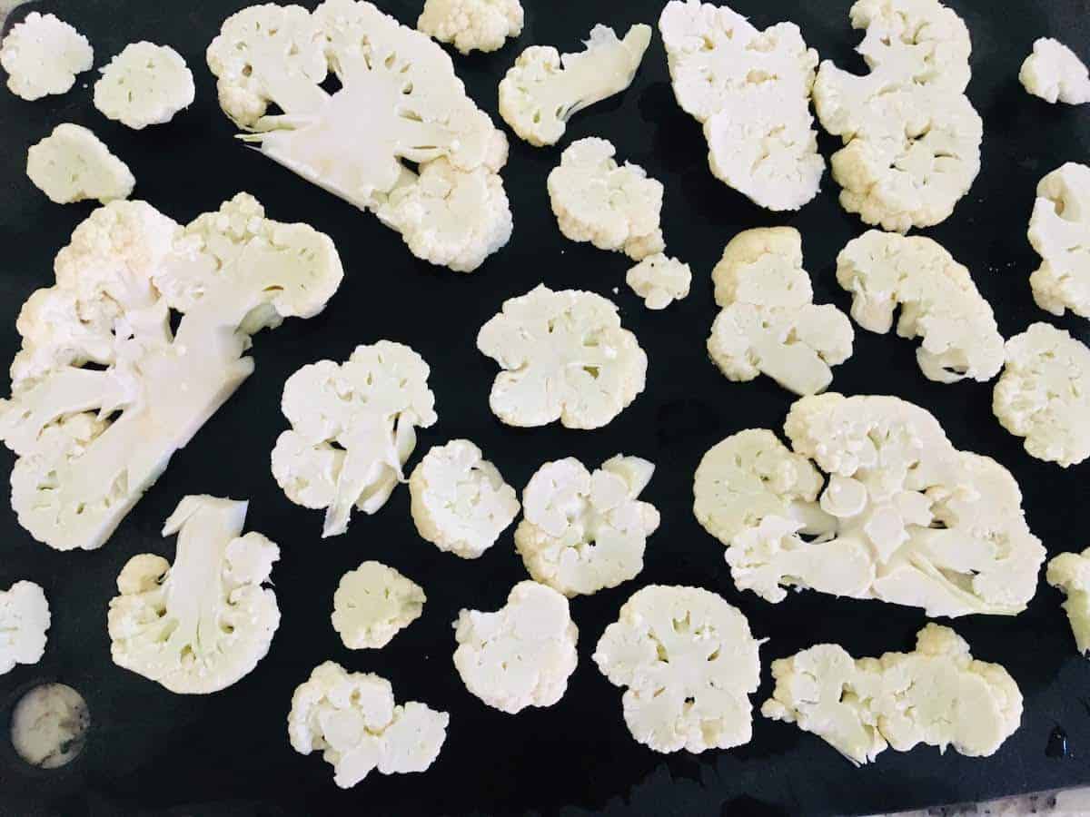 I am cutting the cauliflower florets into cauliflower steaks, then florets.