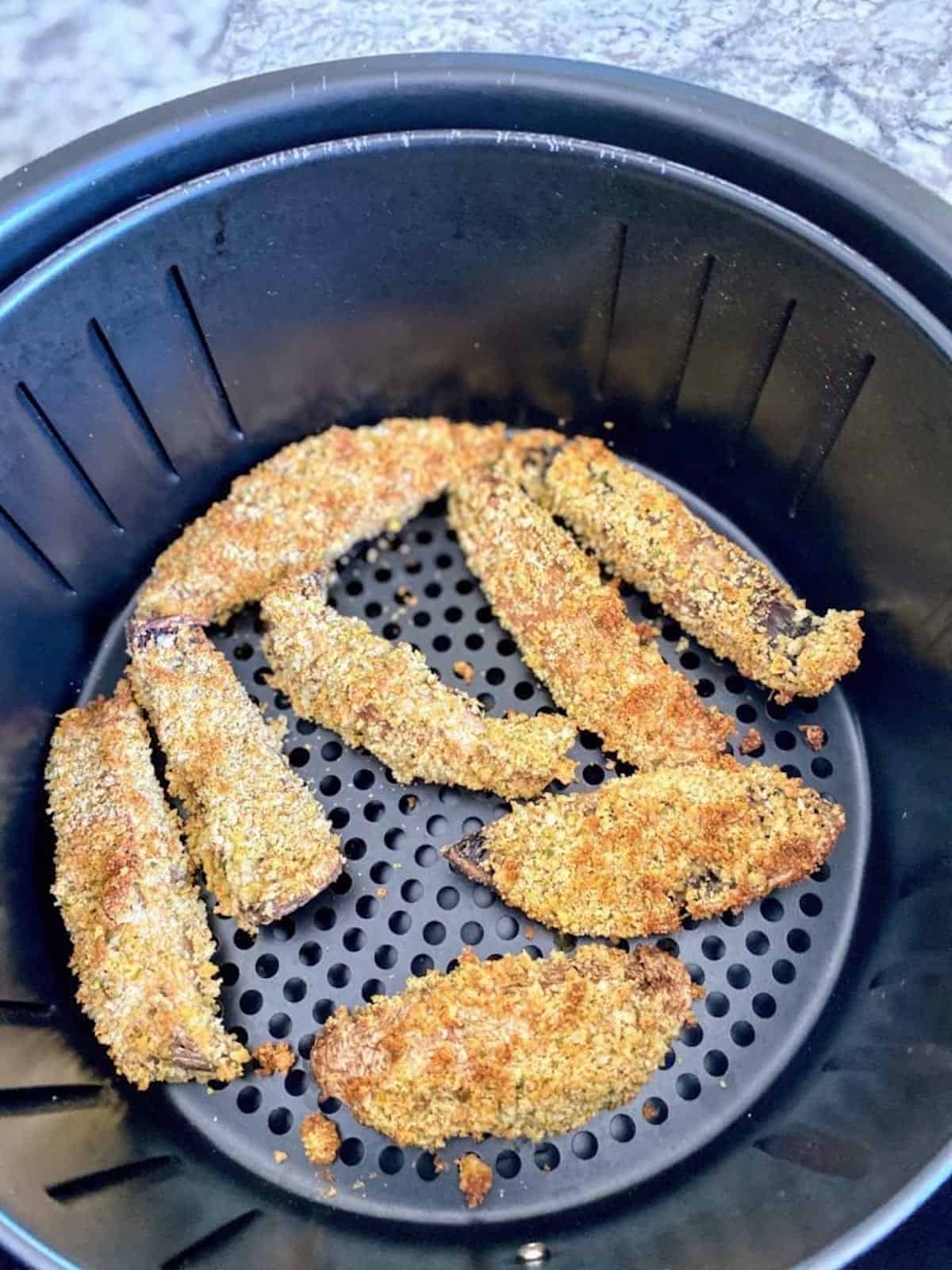 Portobello fries recipe cooked in an air fryer basket. 