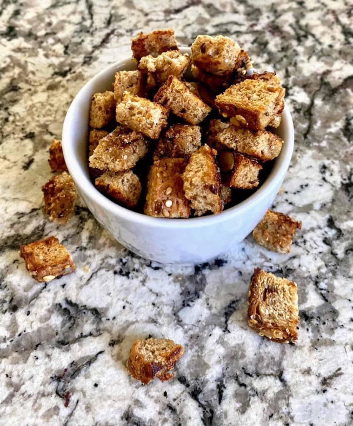 Garlic croutons in a bowl on the table. 