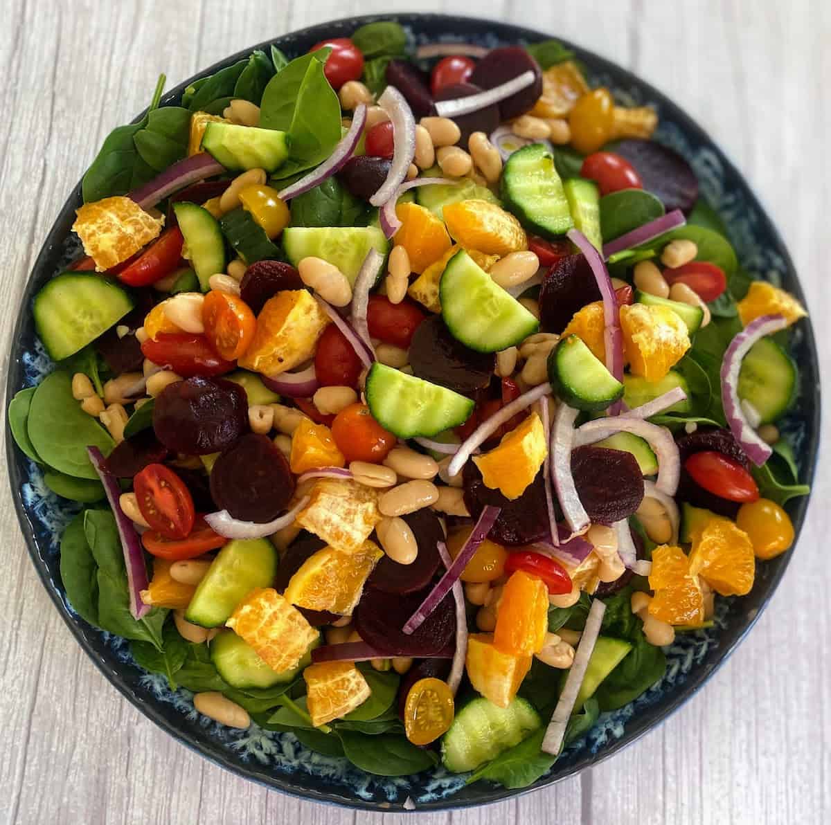 Salad on a plate on the table.
