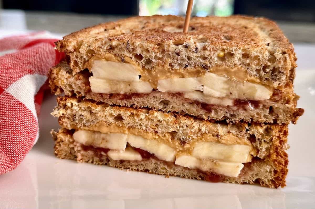Grilled PBBJ sandwich on a plate. 