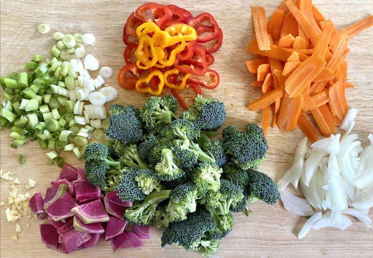 Cut vegetables on a cutting board. 