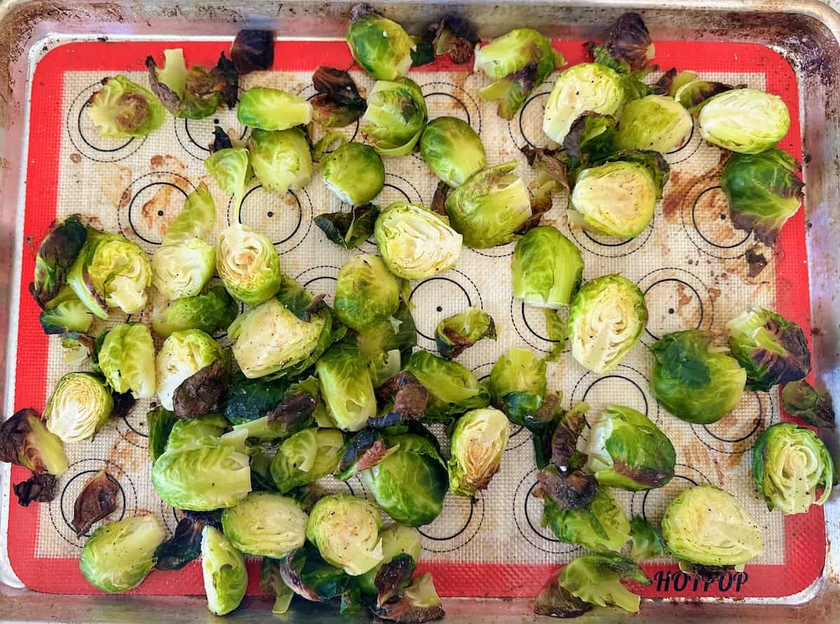 Roasted Brussels sprouts on a baking sheet. 