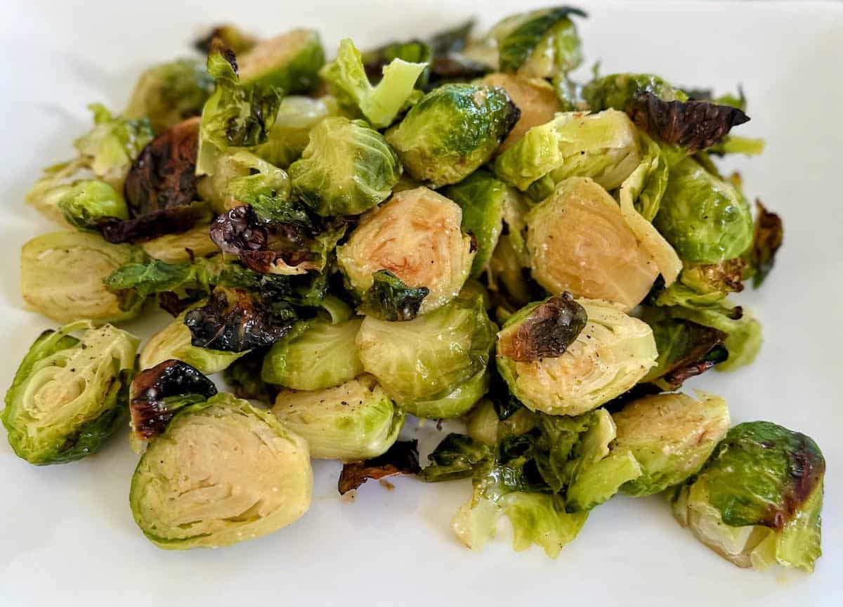 Maple Miso Brussel sprouts on a plate on the table.