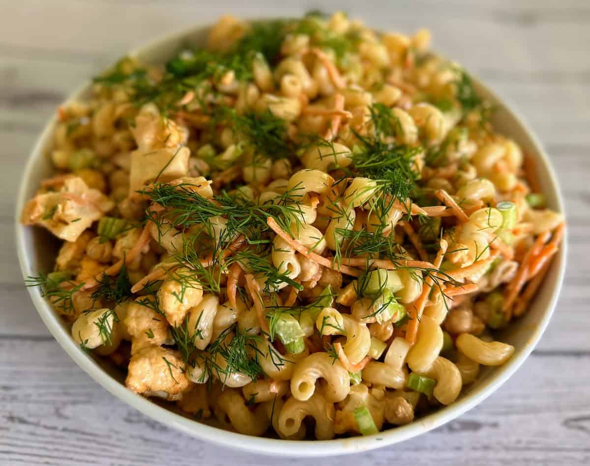 The recipe on the table with fresh dill.